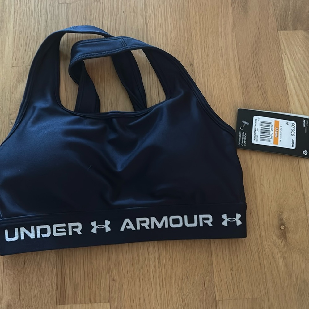 Brand new with tags. UA Navy Sports Bra size Small